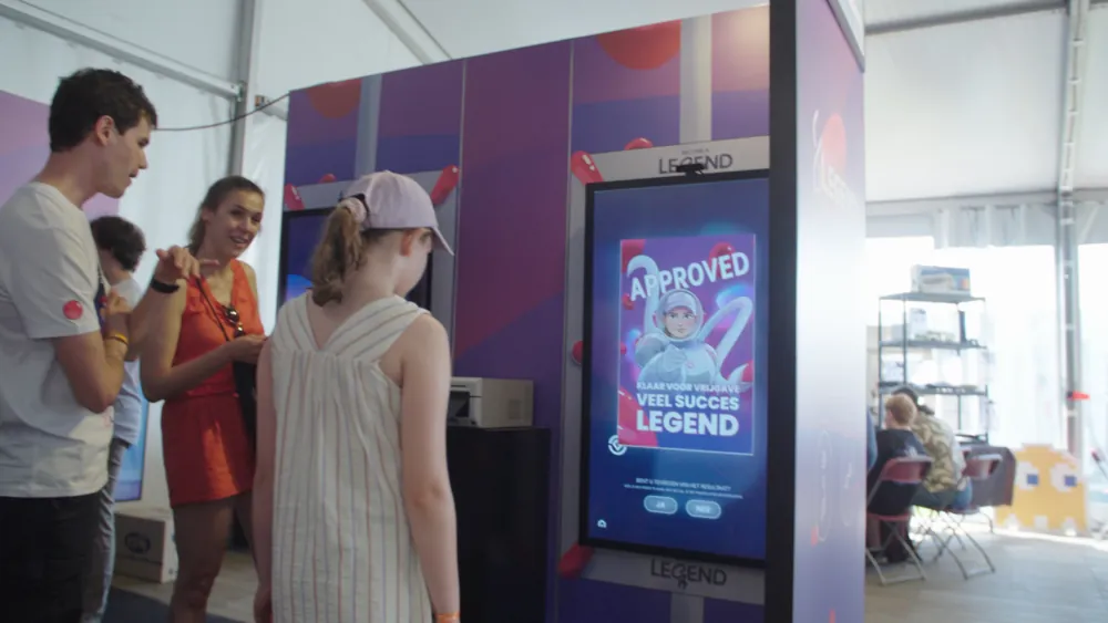 A visitor at the Celfie Scanner kiosk, her celfie shown on screen